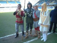 Monkey, Pigsy, Sandy and Tripitaka on the pitch at Millwall football ground